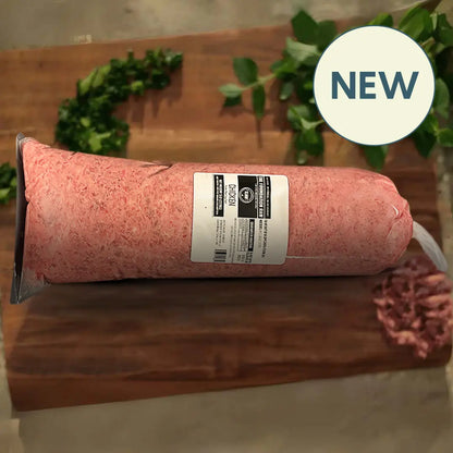 Rolled meat product with a label on a wooden surface, featuring a 'NEW' badge.