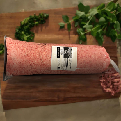 Rolled meat product with a label on a wooden surface