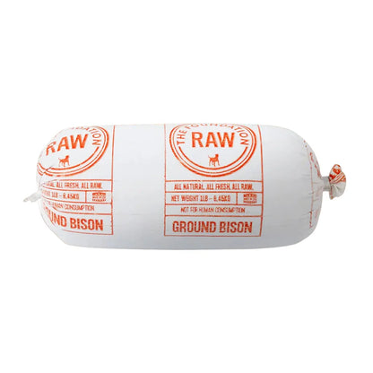 Rolled meat dog food with transparent plastic packaging labeled "The Foundation Raw, Ground Bison" 