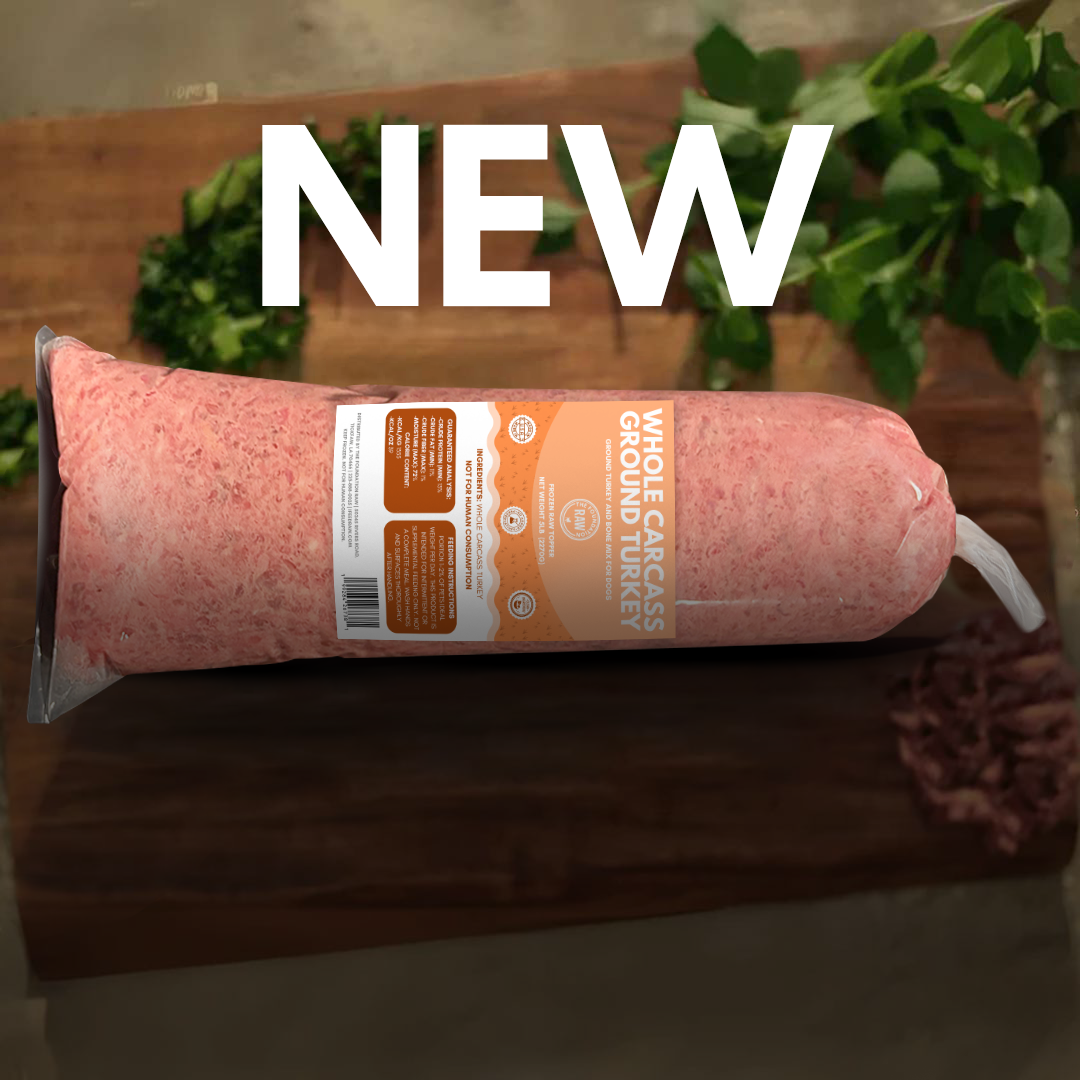 Package of ground turkey on a wooden surface with greenery in the background